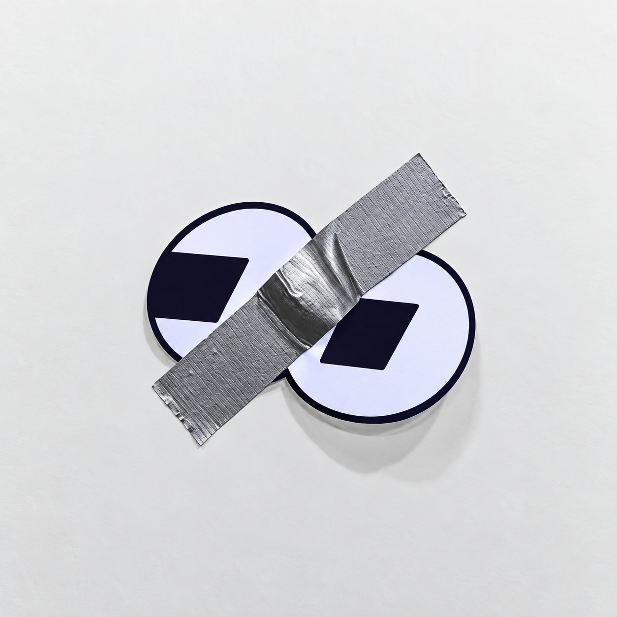 FOMEDIAN taped logo on white wall